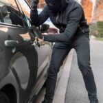 close-up-man-trying-break-into-car (1)
